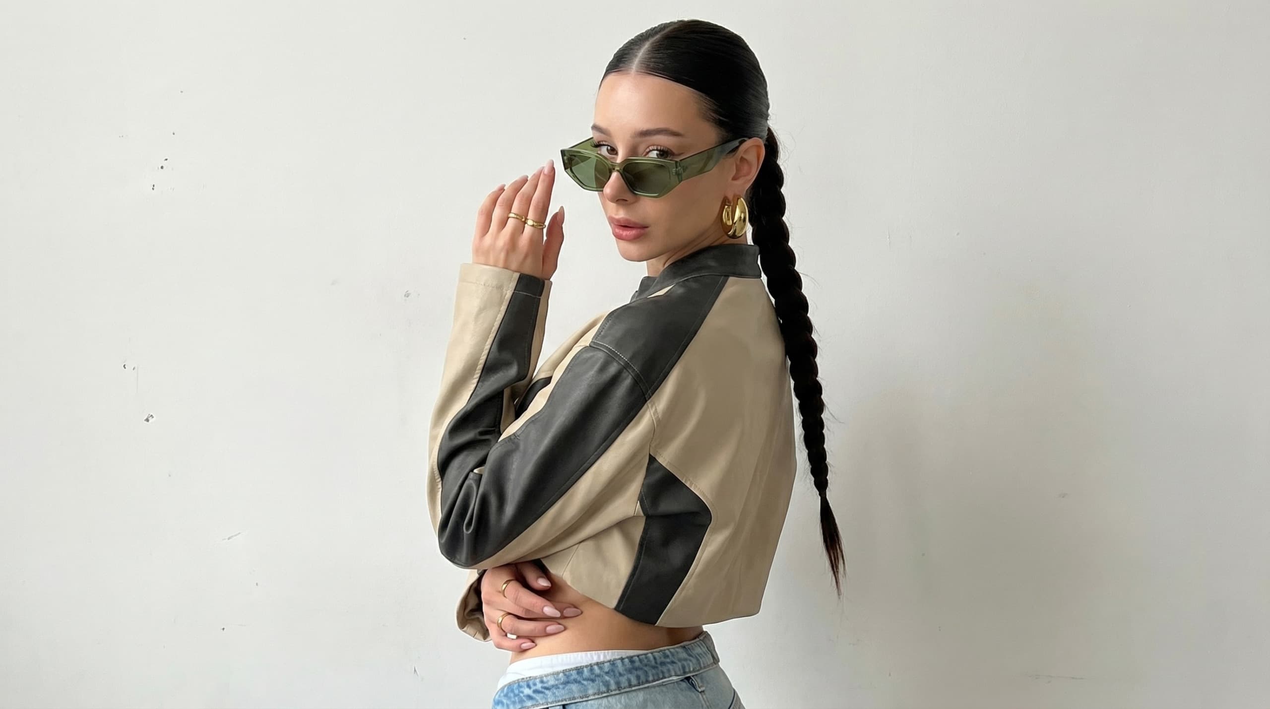 Minimal studio streetwear side portrait AI influencer prompt - oversized jacket and braided ponytail Minimal studio streetwear side portrait AI influencer prompt - oversized jacket and braided ponytail